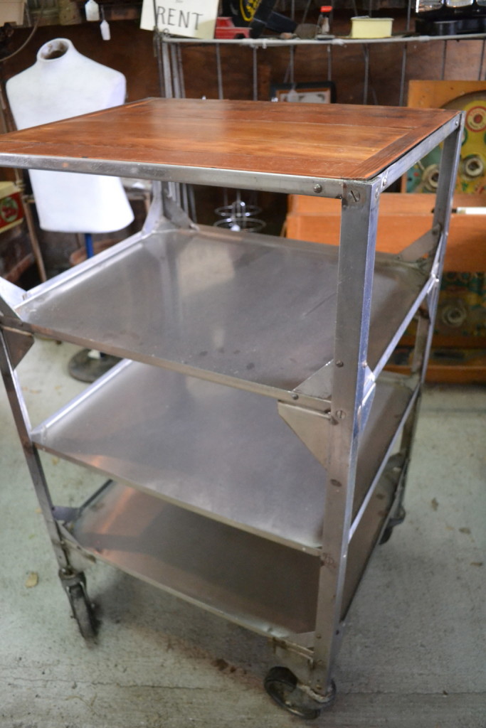 Stainless steel and wood on wheels.  Perfect look and great storage for your kitchen, office, laundry or craft room.