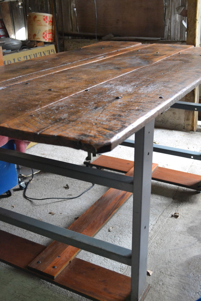 Fabulous, aged farm-table top on an industrial base.  Counter-height.  Perfect island for an eat-in kitchen.  Enough space to tuck in 6 stools - have them out of the way while you're working, and pull them right out when you're not.