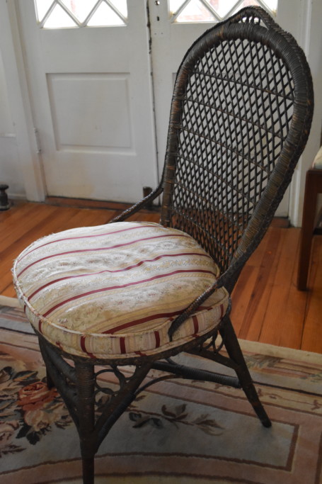 An exceptional late 19th century wicker side chair. This nicely detailed chair once called Boscabel home (my mother's family home). The chair has its original finish and wicker work, but my mother had it re-upholstered in a sublime, French silk stripe.