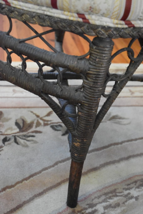 Detail of the wicker side chair's base and legs.
