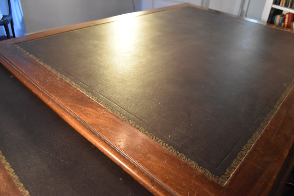 The expansive 5'x7' surface of the desk provided ample space of the pair of English partners who first used it. Look closely, and you'll see that this immense surface is created from one piece of wood. There are no seams. 