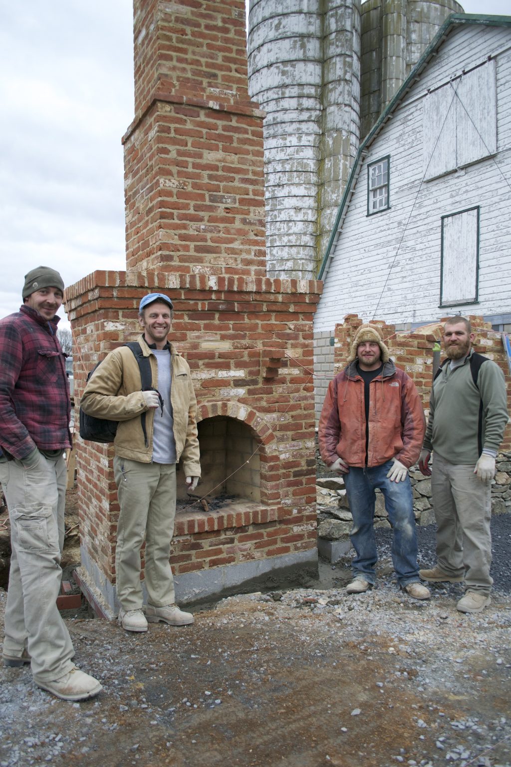 The irrepressible crew, who worked through wind, rain, and snow to finish this huge job inside of a month.