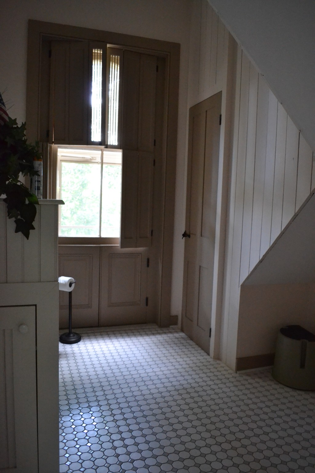 The third-floor bathroom, with its little door accessing the cupola.
