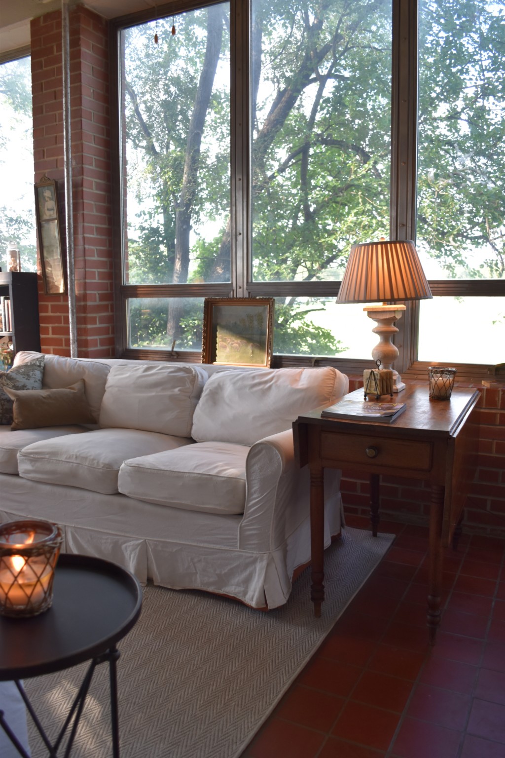 glass room, slip-covered sofa