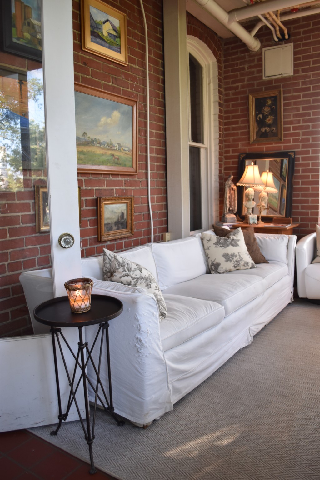 slip-covered sofa, wall of art