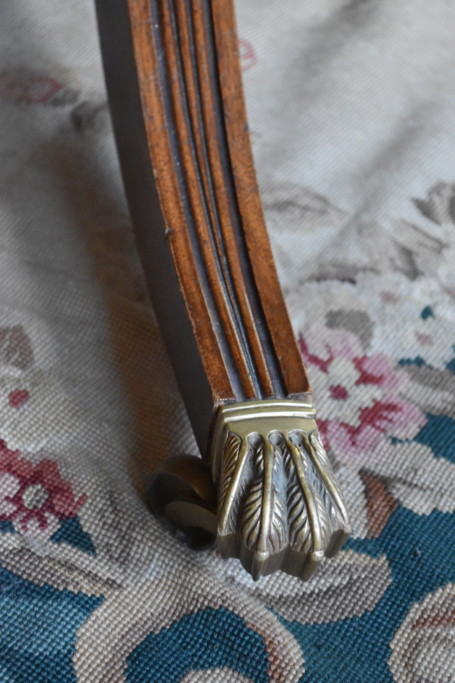Detail of the brass-capped feet of the Belgian dining table
